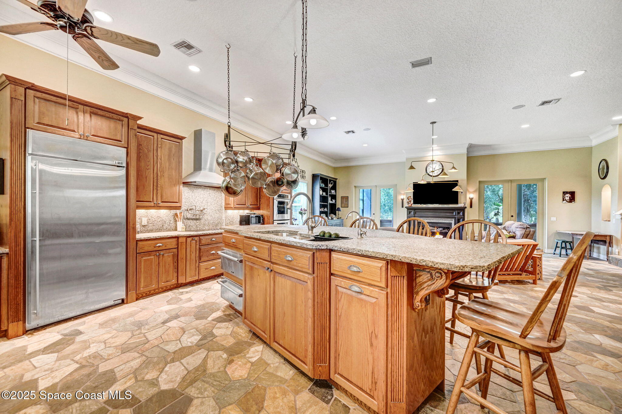 4495 Sand Point Road Grant, FL 32949 - Photo 36 of 87 a large kitchen with a large counter top appliances and cabinets