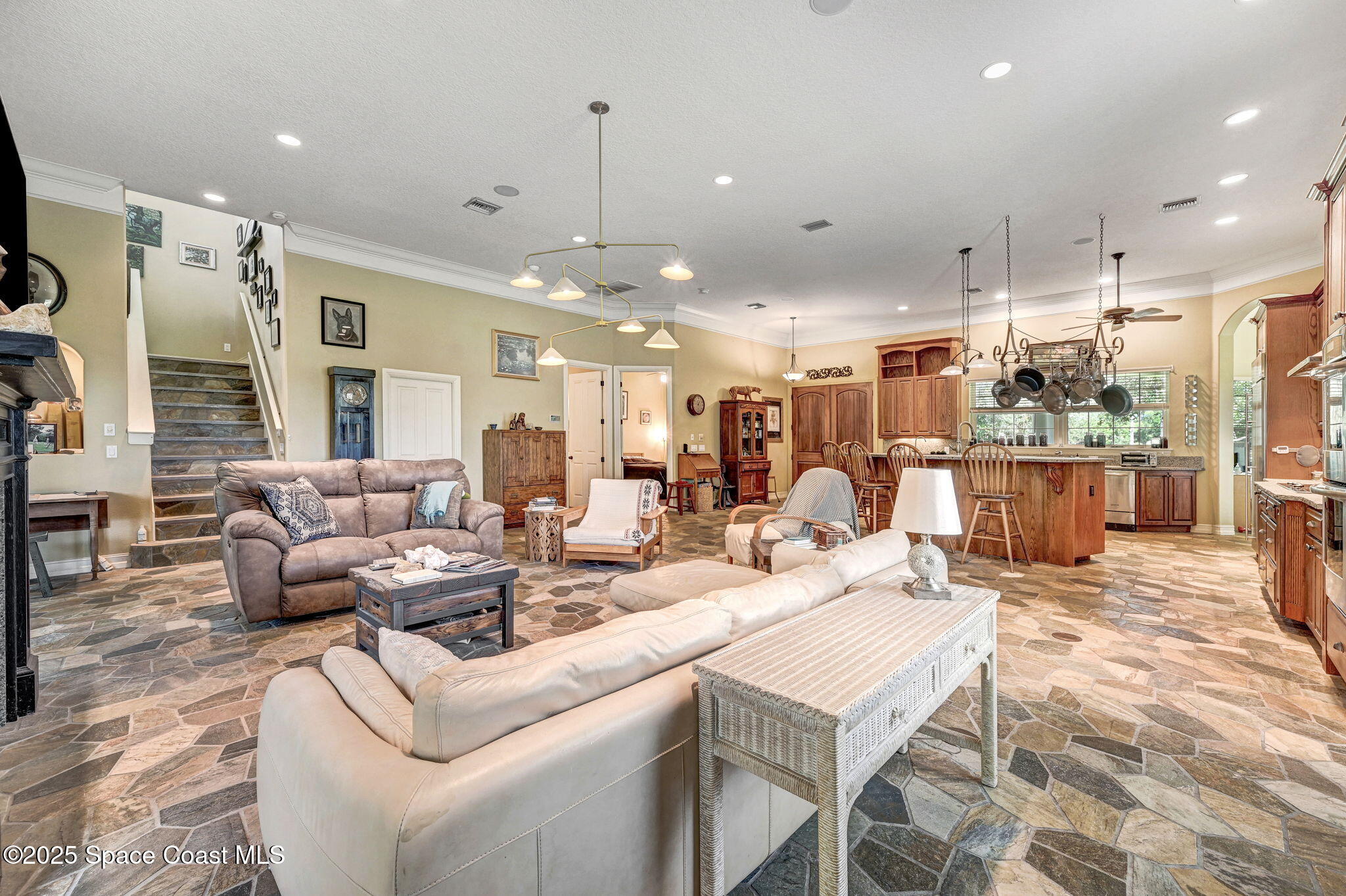 4495 Sand Point Road Grant, FL 32949 - Photo 46 of 87 a living room with lots of furniture and a view of kitchen