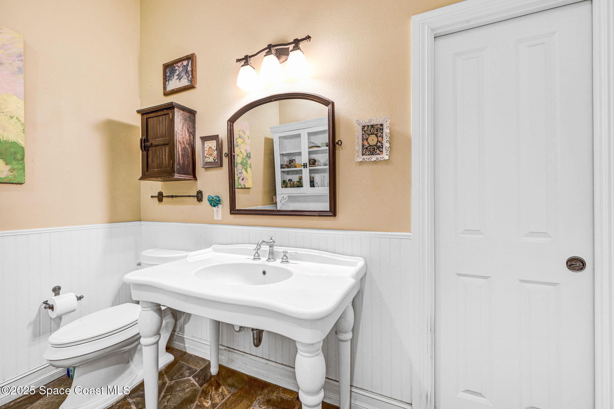 4495 Sand Point Road Grant, FL 32949 - Photo 50 of 87 a bathroom with a sink and a mirror