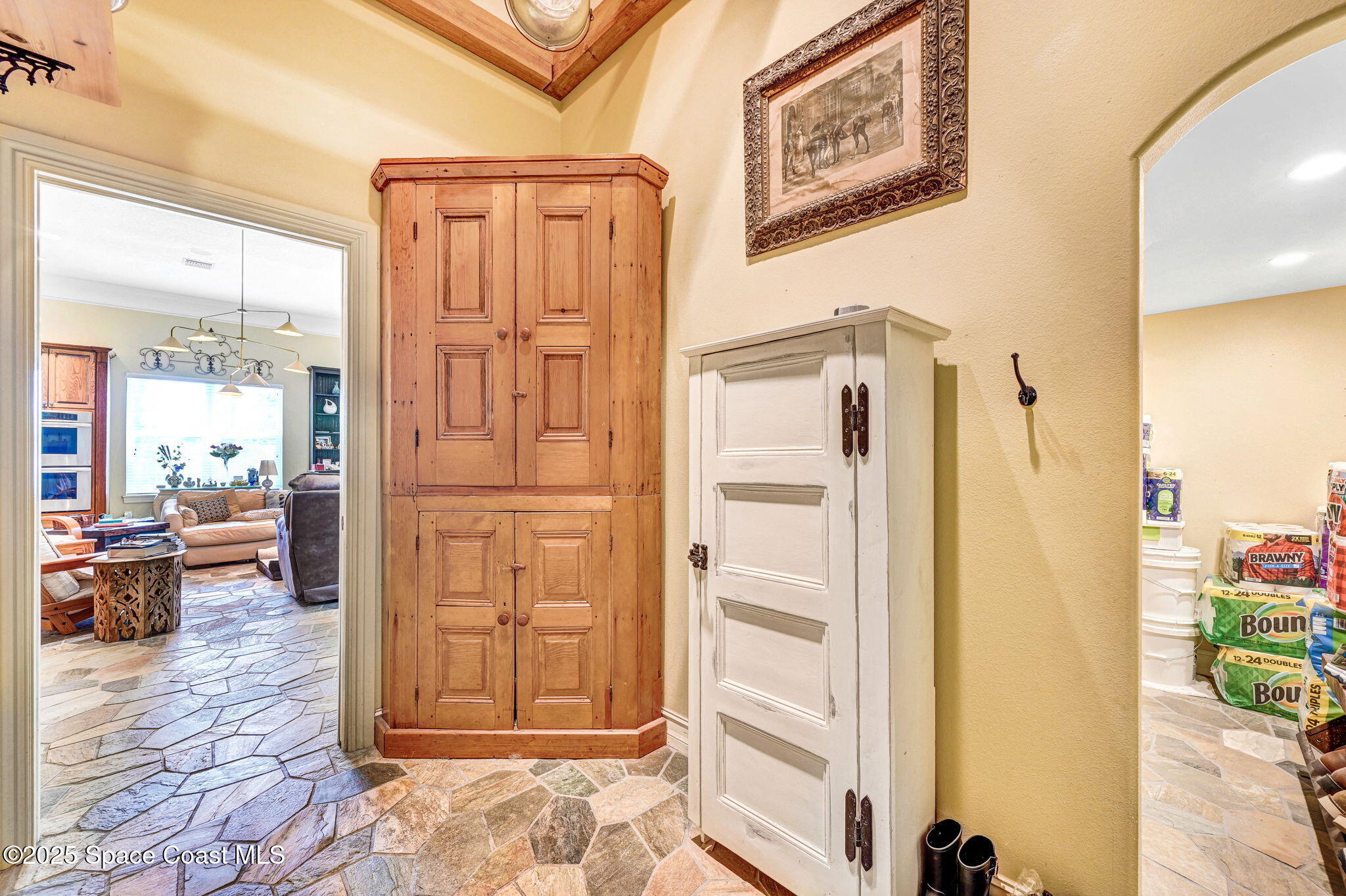 4495 Sand Point Road Grant, FL 32949 - Photo 54 of 87 a view of a hallway with wooden floor and windows
