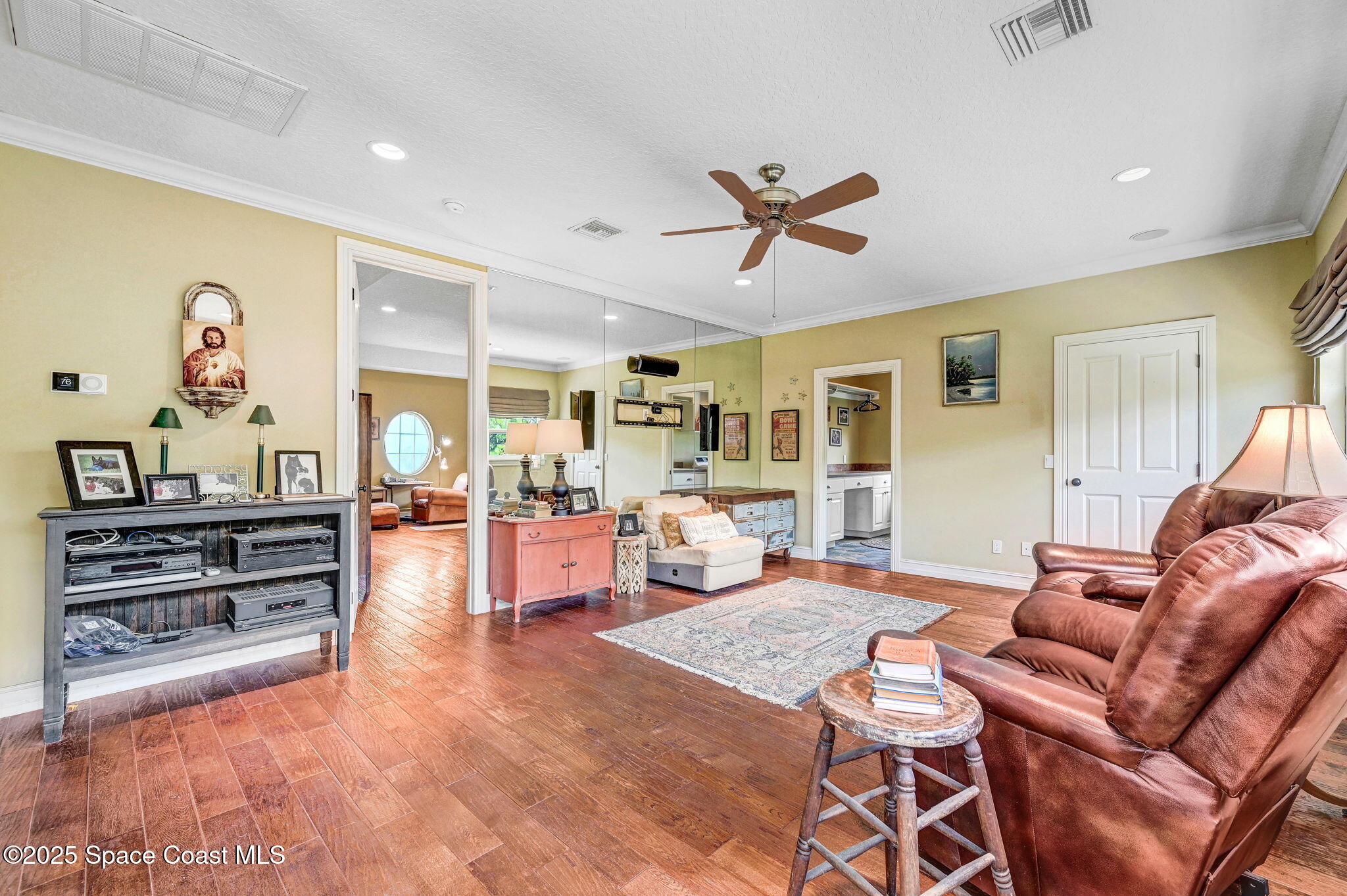 4495 Sand Point Road Grant, FL 32949 - Photo 57 of 87 a living room with furniture and a flat screen tv