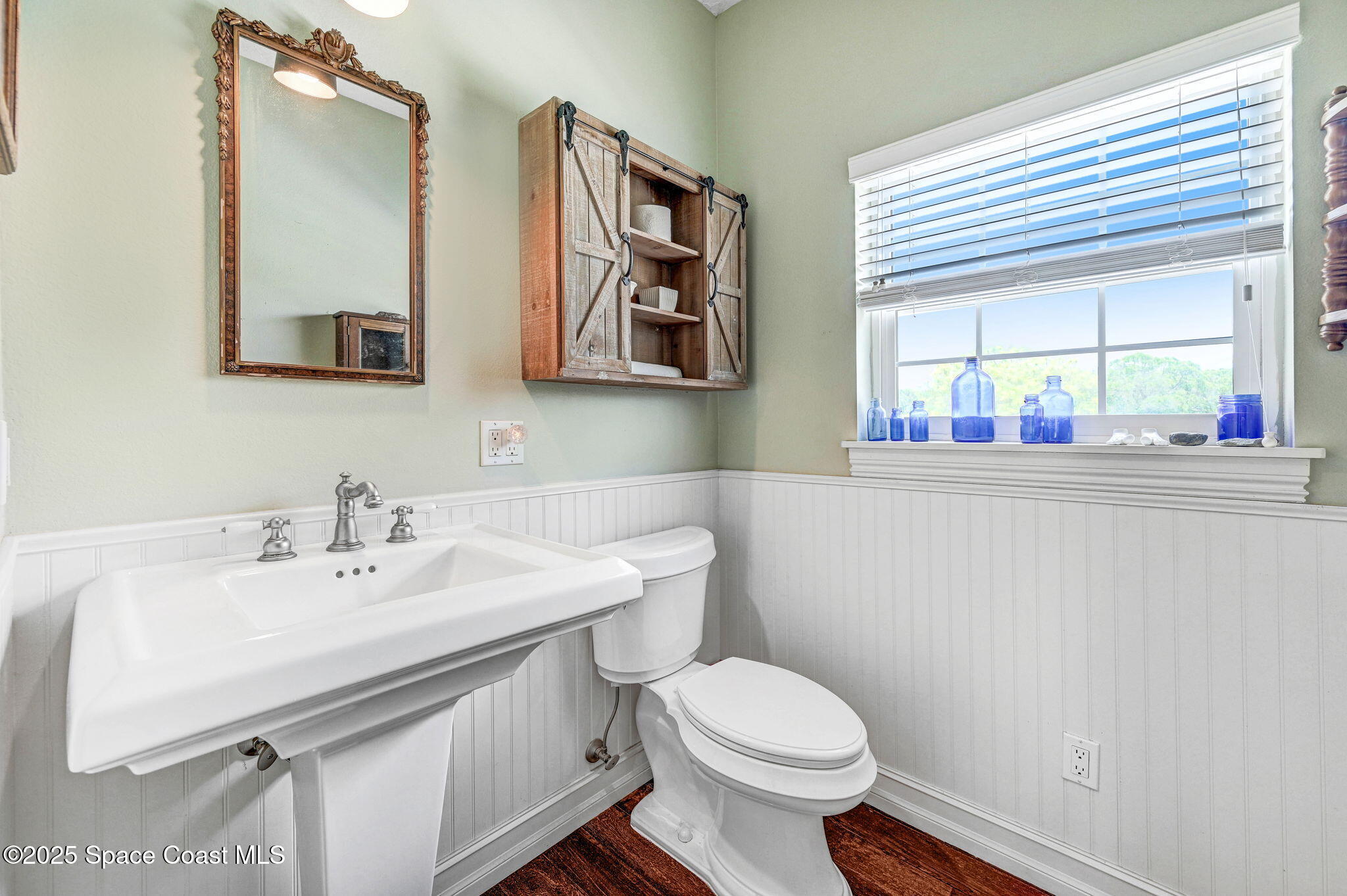 4495 Sand Point Road Grant, FL 32949 - Photo 59 of 87 a bathroom with a sink and a mirror