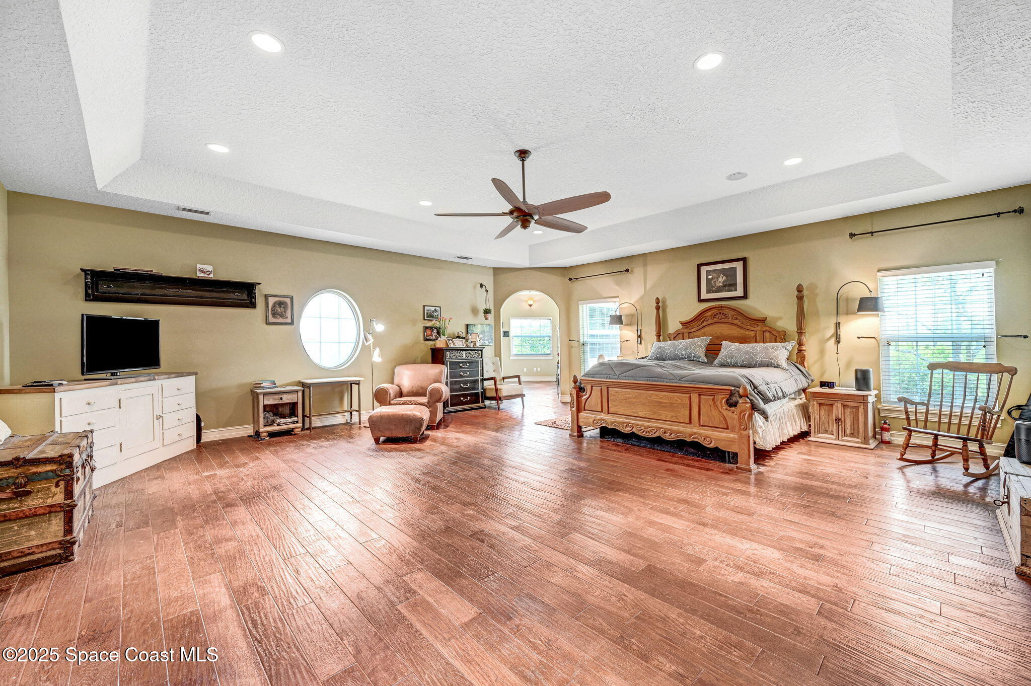 4495 Sand Point Road Grant, FL 32949 - Photo 60 of 87 a living room with furniture and a flat screen tv
