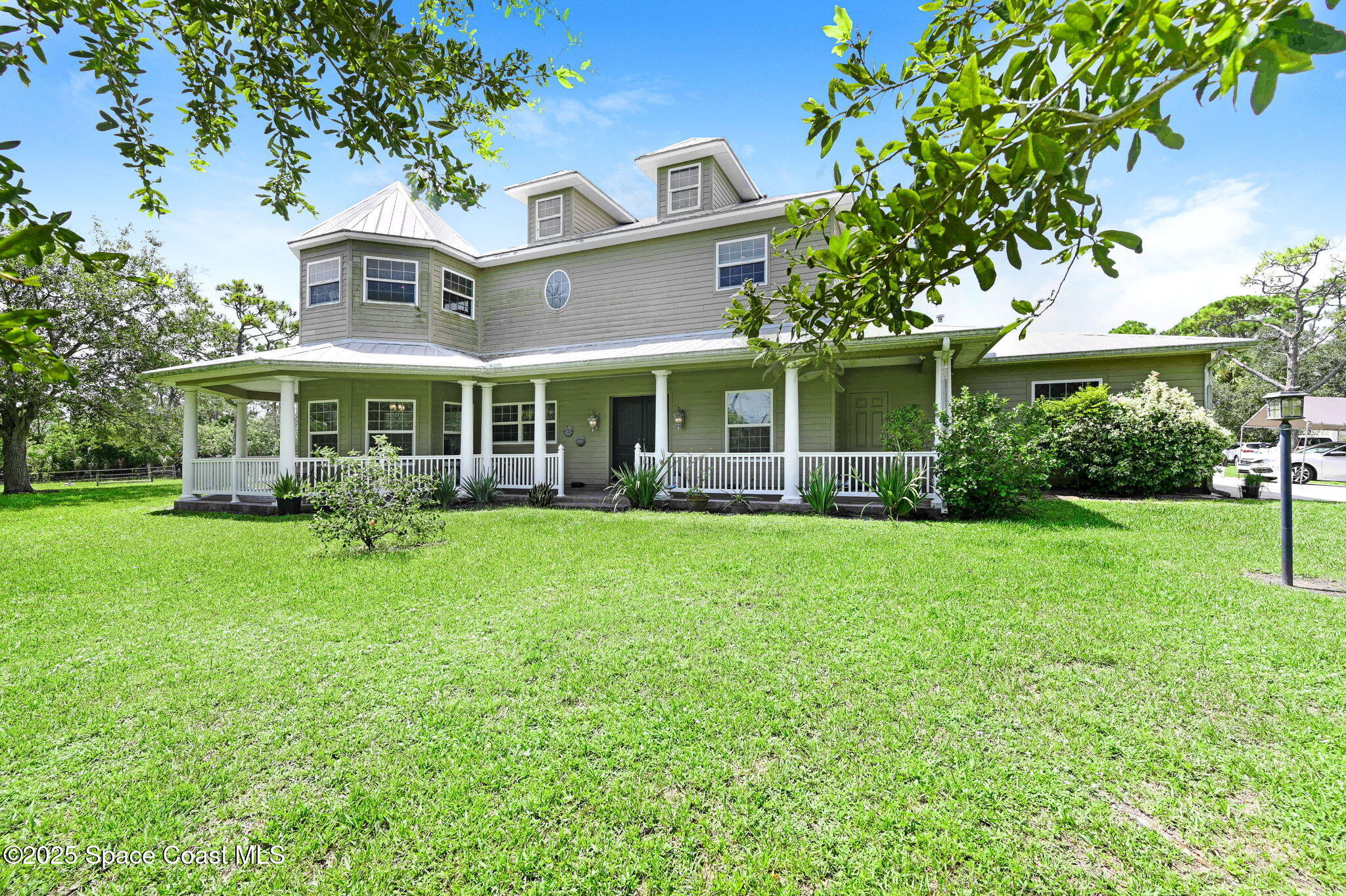 4495 Sand Point Road Grant, FL 32949 - Photo 73 of 87 a front view of a house with a yard