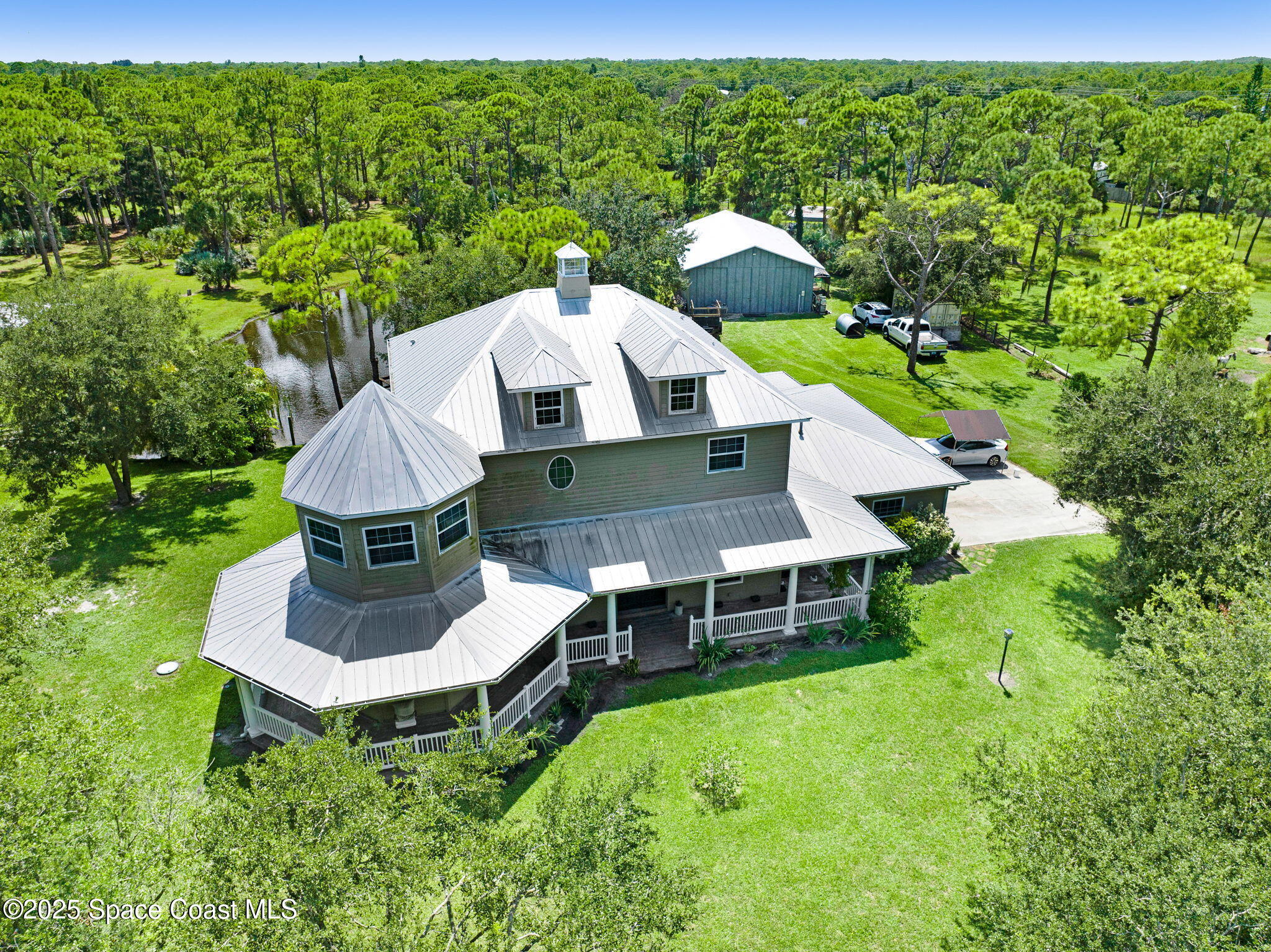 4495 Sand Point Road Grant, FL 32949 - Photo 82 of 87 an aerial view of a house with garden space and street view