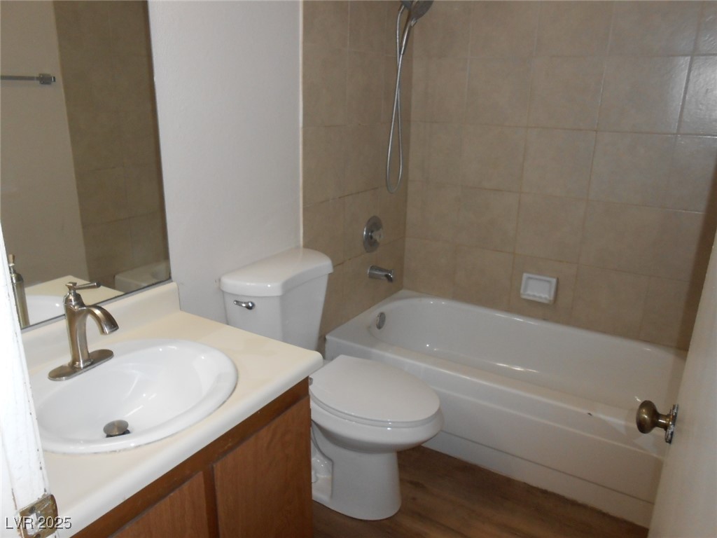 4720 Krissylouise Way, Unit B Las Vegas, NV 89121 - Photo 6 of 14 Full bathroom with shower / washtub combination, vanity, and wood finished floors
