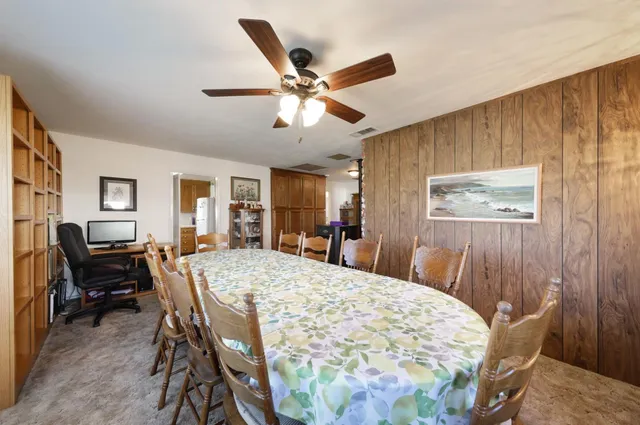 a dining room with furniture and window