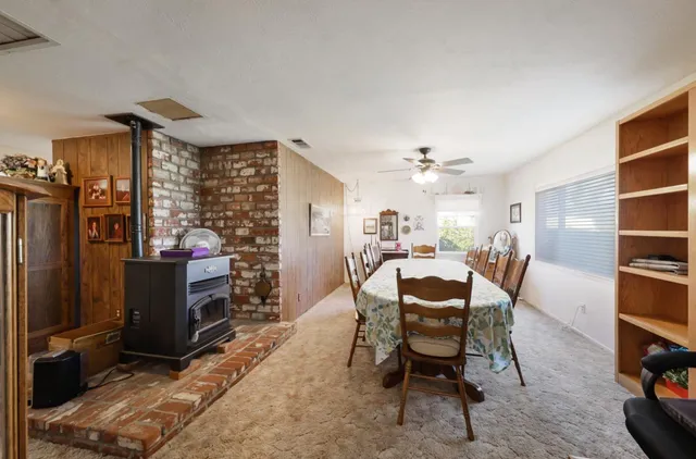 a large kitchen with a large window and stainless steel appliances