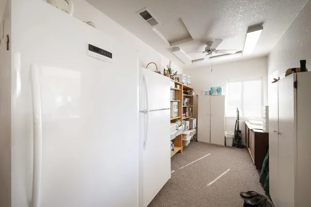 a view of a storage & utility room with closet