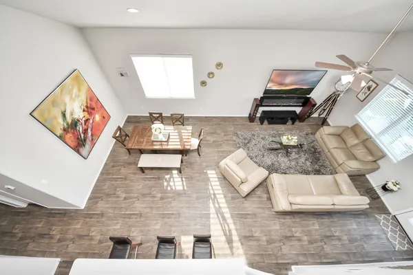 a bedroom with a large bed and a painting on the wall