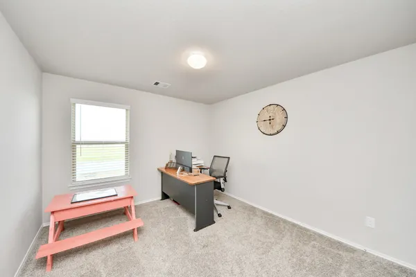 a view of a house with a yard and sitting area