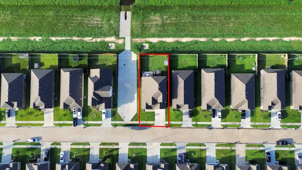 a view of a golf course with a big yard