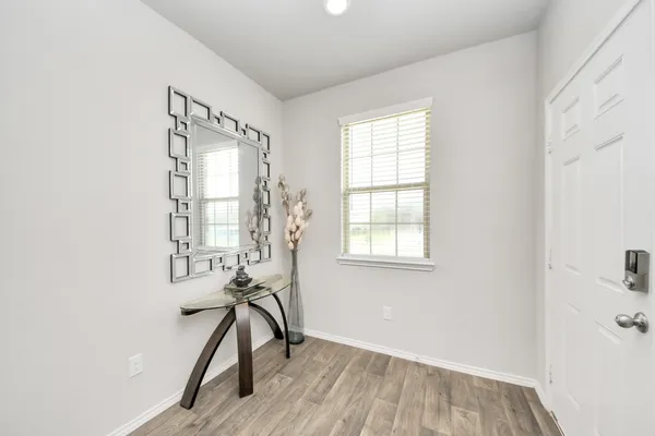 a view of a hallway with staircase