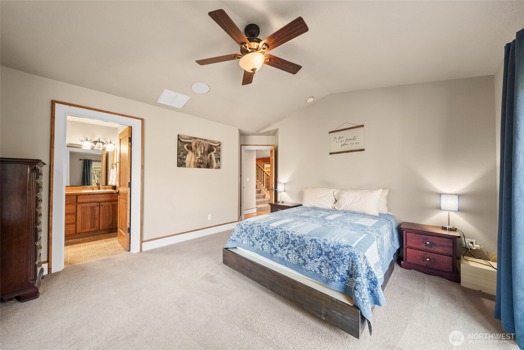 340 Arrowhead Road Ariel, WA 98603 - Photo 11 of 40 a bedroom with a bed and a chandelier