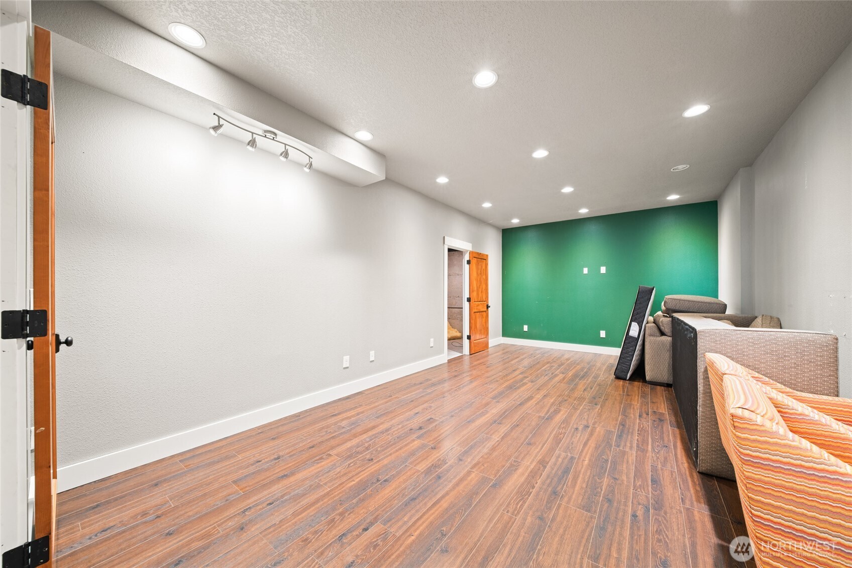 340 Arrowhead Road Ariel, WA 98603 - Photo 22 of 40 a big room with wooden floor and balcony