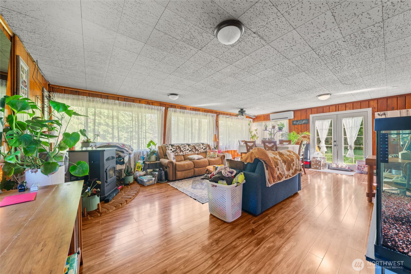 340 Arrowhead Road Ariel, WA 98603 - Photo 35 of 40 a living room with furniture floor to ceiling window and wooden floor