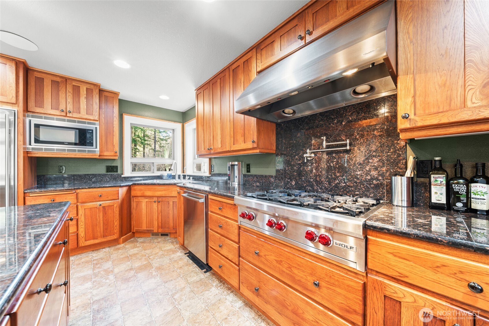 340 Arrowhead Road Ariel, WA 98603 - Photo 6 of 40 a kitchen with stainless steel appliances granite countertop a sink and cabinets