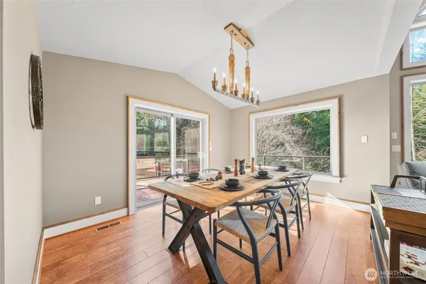 a view of a dining room with furniture window and outside view