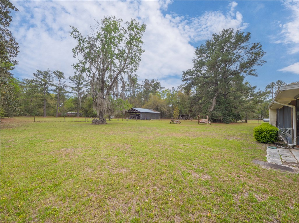 220 Arthur Knowles Road Folkston, GA 31537 - Photo 31 of 46 Back Yard/Pole Barn
