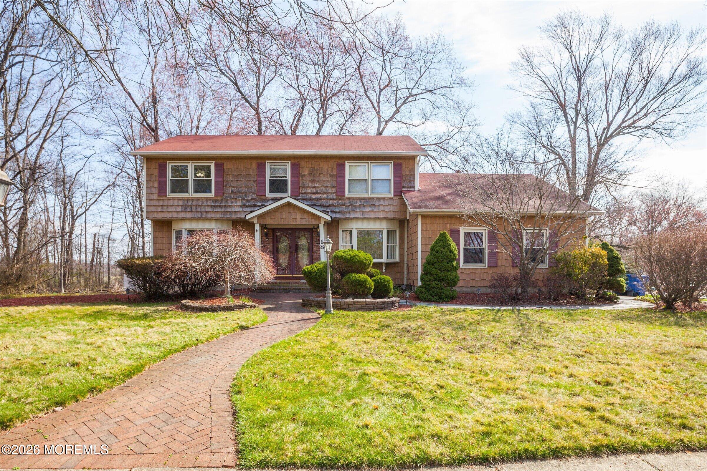 18 Warne Road Matawan, NJ 07747 - Photo 1 of 28 a view of a house with a yard patio and fire pit