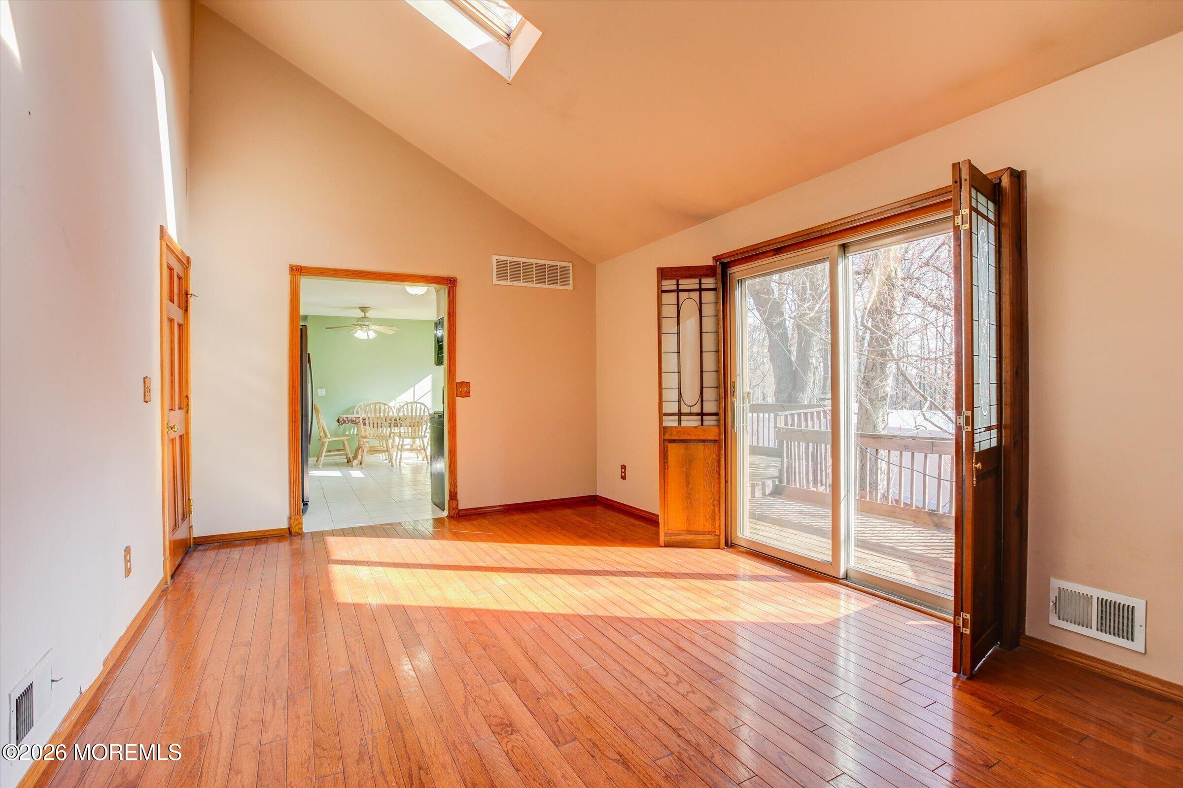 18 Warne Road Matawan, NJ 07747 - Photo 14 of 28 a view of an empty room with wooden floor and a window