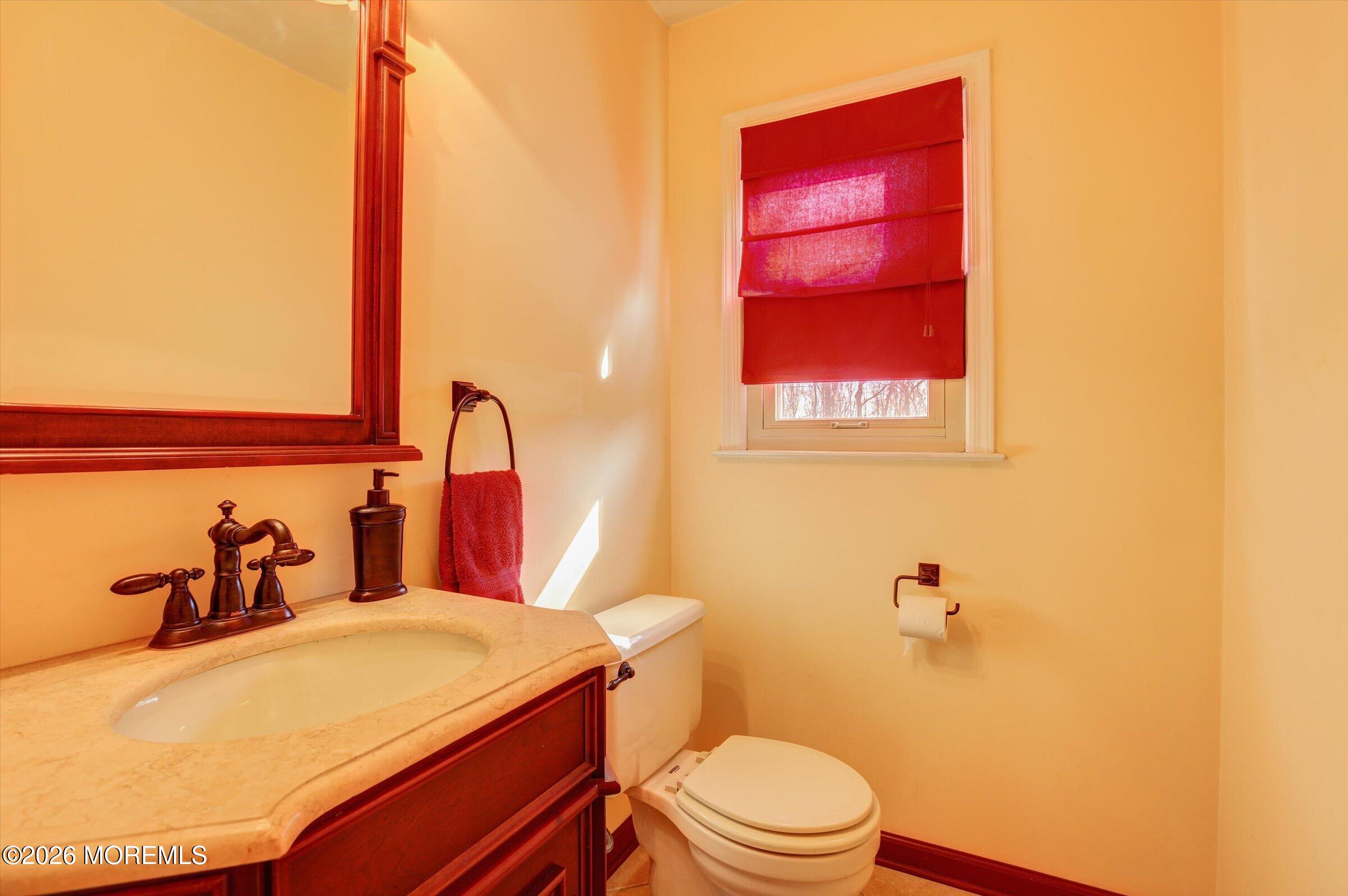 18 Warne Road Matawan, NJ 07747 - Photo 16 of 28 a bathroom with a sink and a toilet
