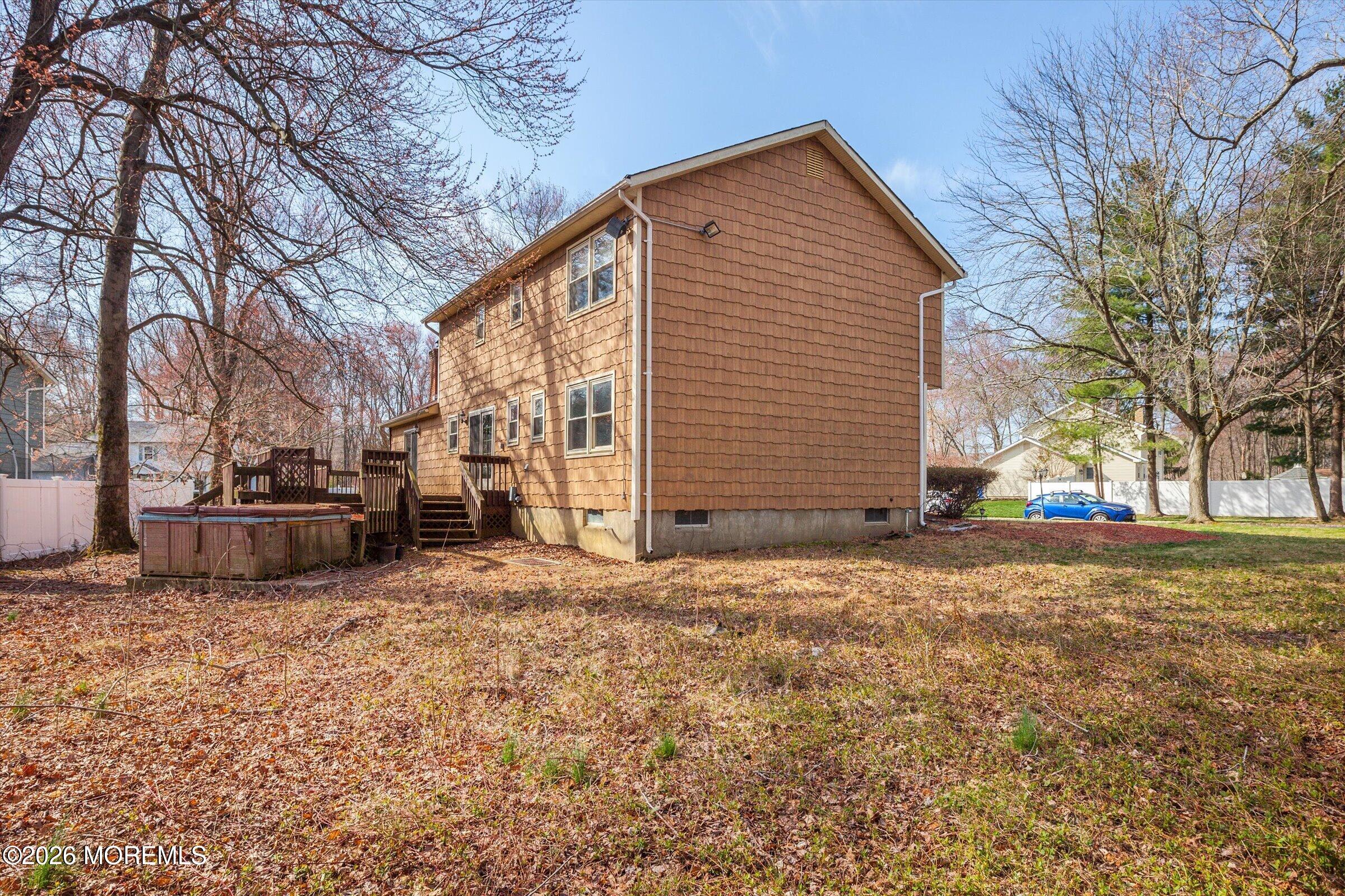 18 Warne Road Matawan, NJ 07747 - Photo 27 of 28 a house with trees in front of it