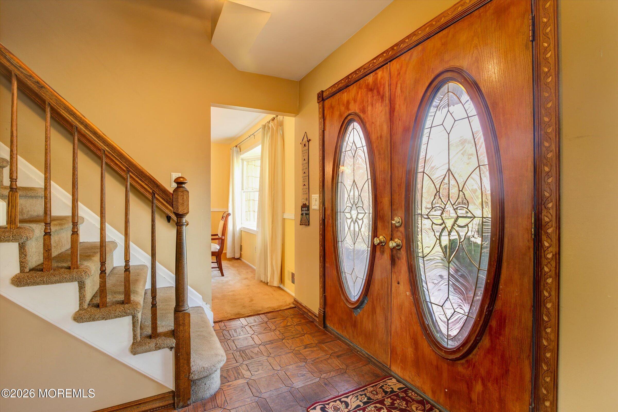 18 Warne Road Matawan, NJ 07747 - Photo 5 of 28 a view of an entryway with wooden floor and door