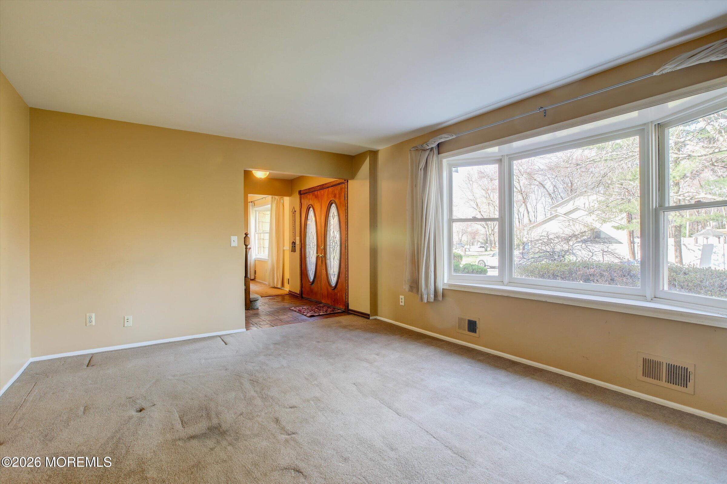 18 Warne Road Matawan, NJ 07747 - Photo 7 of 28 a view of an empty room with a window
