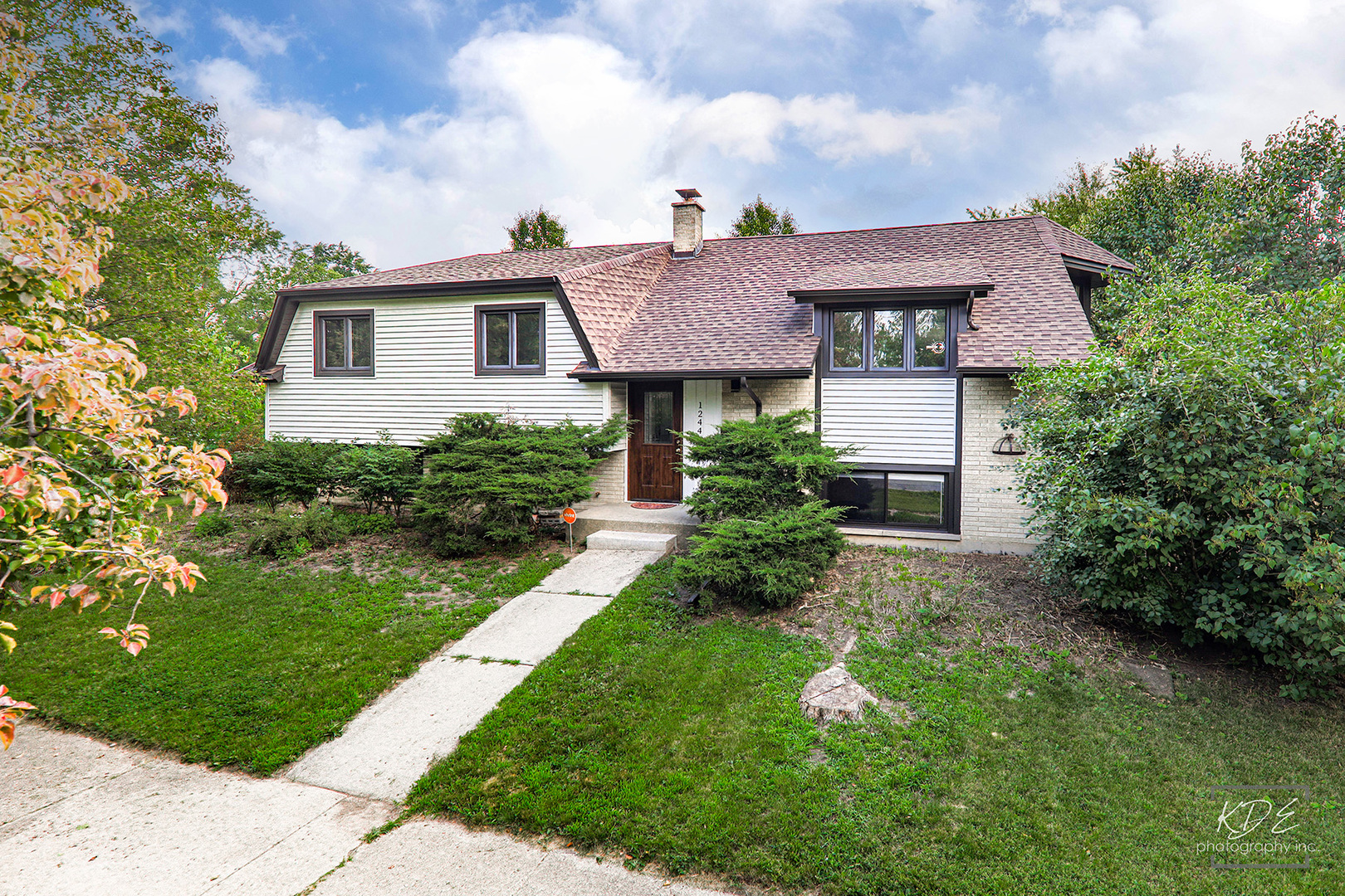 1244 Modaff Road Naperville, IL 60540 - Photo 1 of 19 a front view of a house with a yard