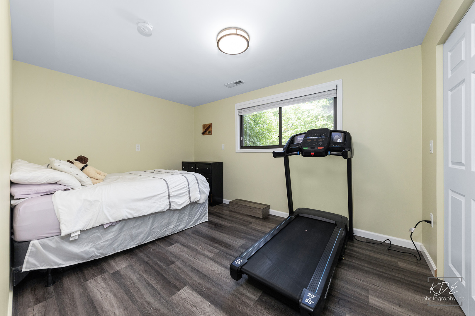 1244 Modaff Road Naperville, IL 60540 - Photo 15 of 19 a bedroom with a bed and wooden floor