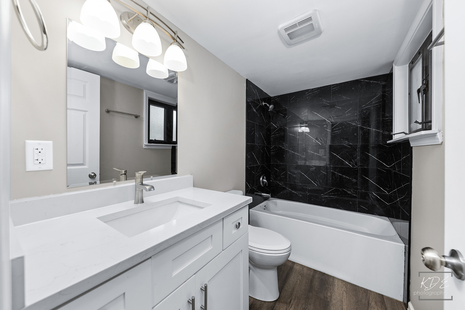1244 Modaff Road Naperville, IL 60540 - Photo 16 of 19 a bathroom with a sink a toilet a mirror and shower