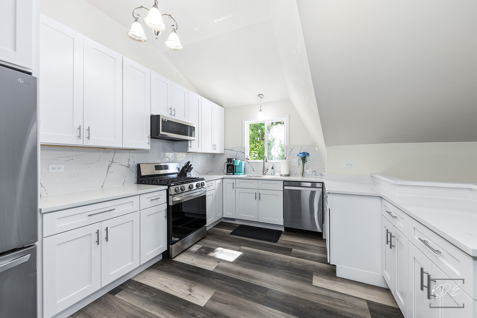1244 Modaff Road Naperville, IL 60540 - Photo 5 of 19 a kitchen with a sink cabinets and window