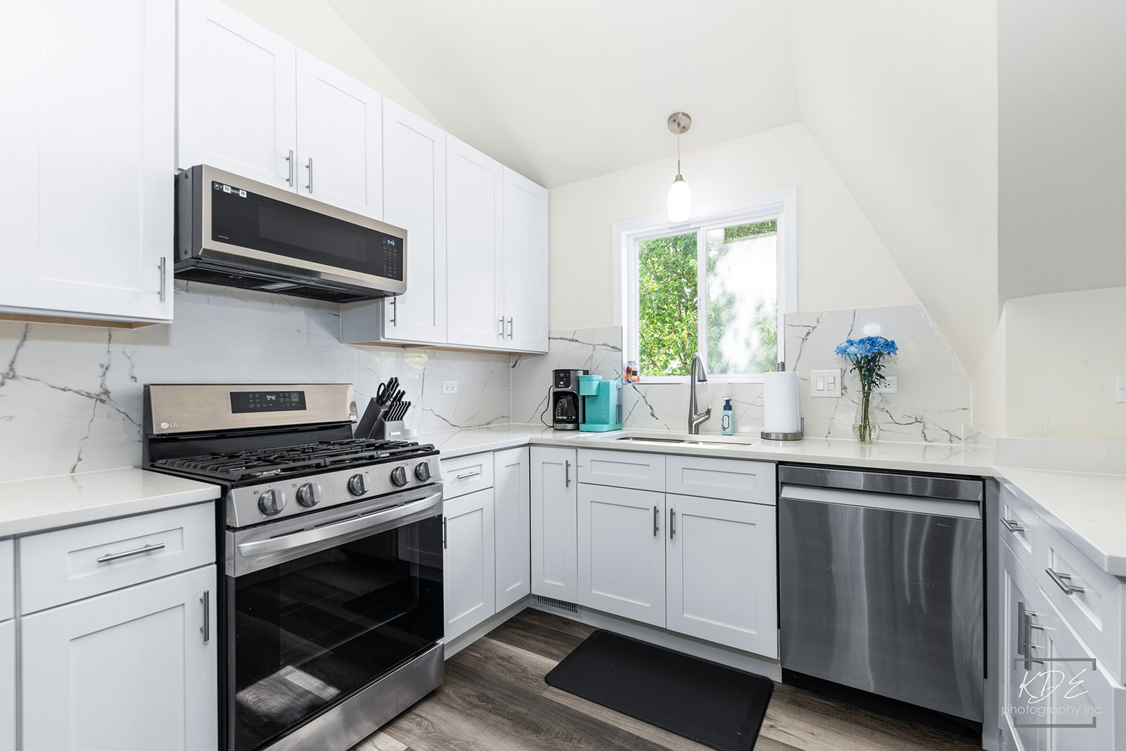 1244 Modaff Road Naperville, IL 60540 - Photo 6 of 19 a kitchen with stainless steel appliances white cabinets granite counter tops and a window