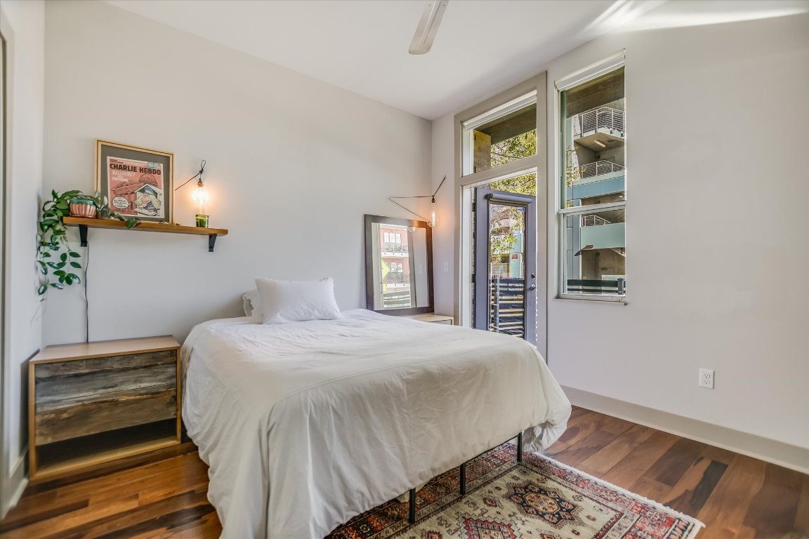 1320 Robert Browning Street, Unit 109 Austin, TX 78723 - Photo 3 of 16 a bedroom with a bed and a window