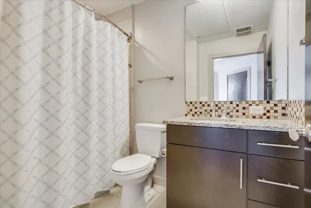 a bedroom with bed and window