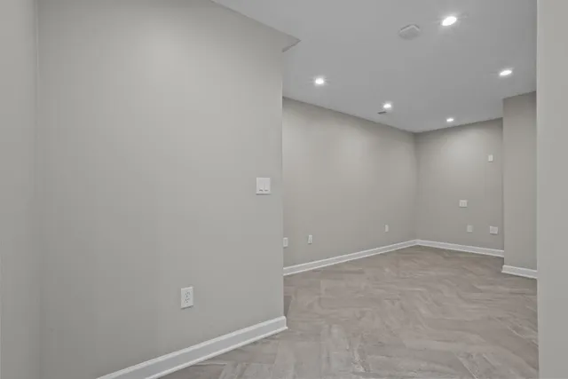 a kitchen with stainless steel appliances granite countertop a sink a stove a microwave cabinets and a window