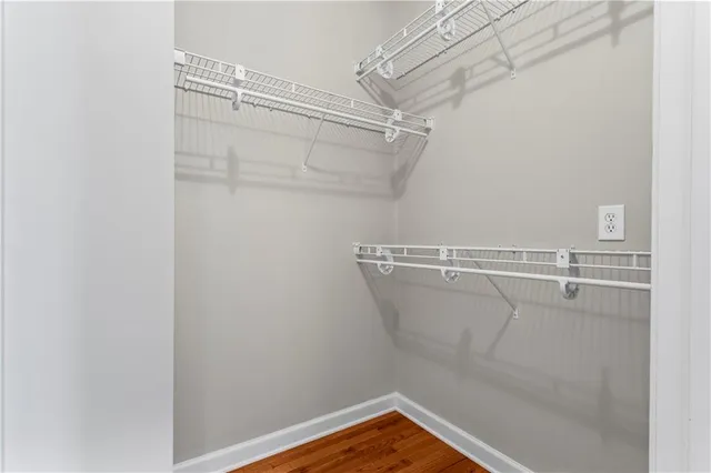 a view of a lake with houses in back