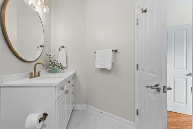 a view of a patio with table and chairs under an umbrella