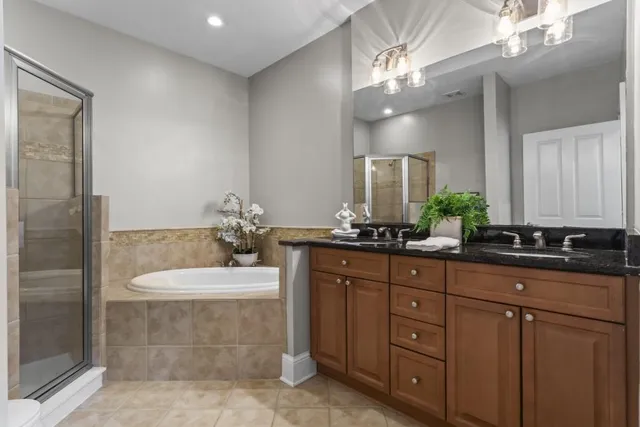a bathroom with a sink double vanity and a mirror