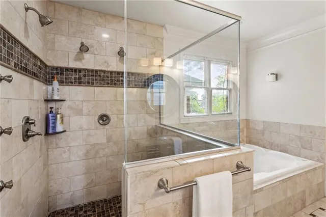 a kitchen with appliances cabinets and a potted plant