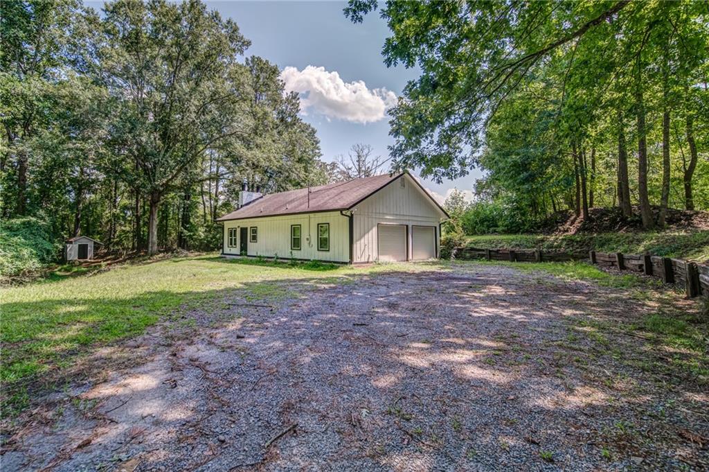 458 Henson Road Canton, GA 30115 - Photo 1 of 1 a front view of a house with garden