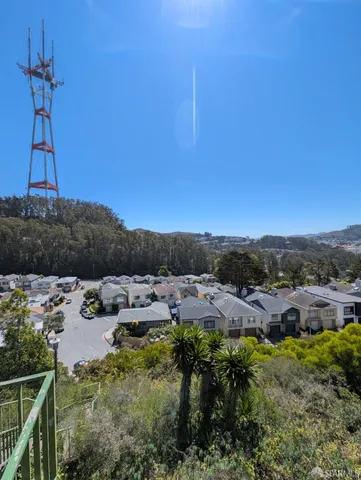 a view of a house with a yard and lake view