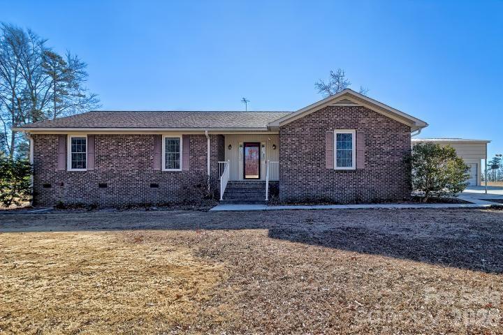 1139 Merribrook Lane Lancaster, SC 29720 - Photo 1 of 37 a front view of a house with a garden