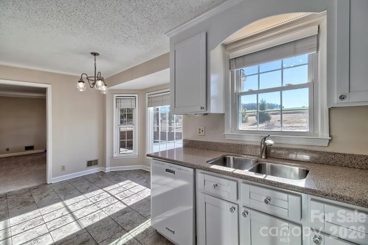 1139 Merribrook Lane Lancaster, SC 29720 - Photo 15 of 37 a kitchen that has a sink cabinets counter space and a window