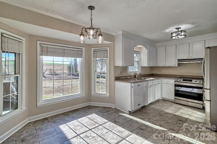 1139 Merribrook Lane Lancaster, SC 29720 - Photo 17 of 37 a kitchen that has a lot of cabinets and window