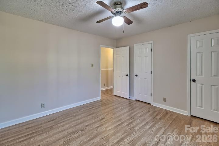 1139 Merribrook Lane Lancaster, SC 29720 - Photo 21 of 37 an empty room with wooden floor fan and windows
