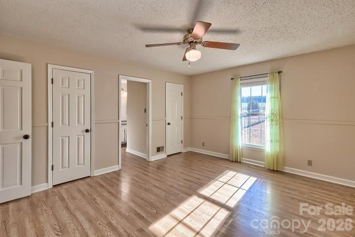 1139 Merribrook Lane Lancaster, SC 29720 - Photo 24 of 37 a view of empty room with wooden floor and fan