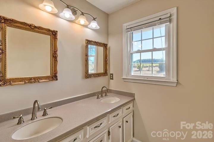 1139 Merribrook Lane Lancaster, SC 29720 - Photo 26 of 37 a bathroom with 2 sink and a mirror