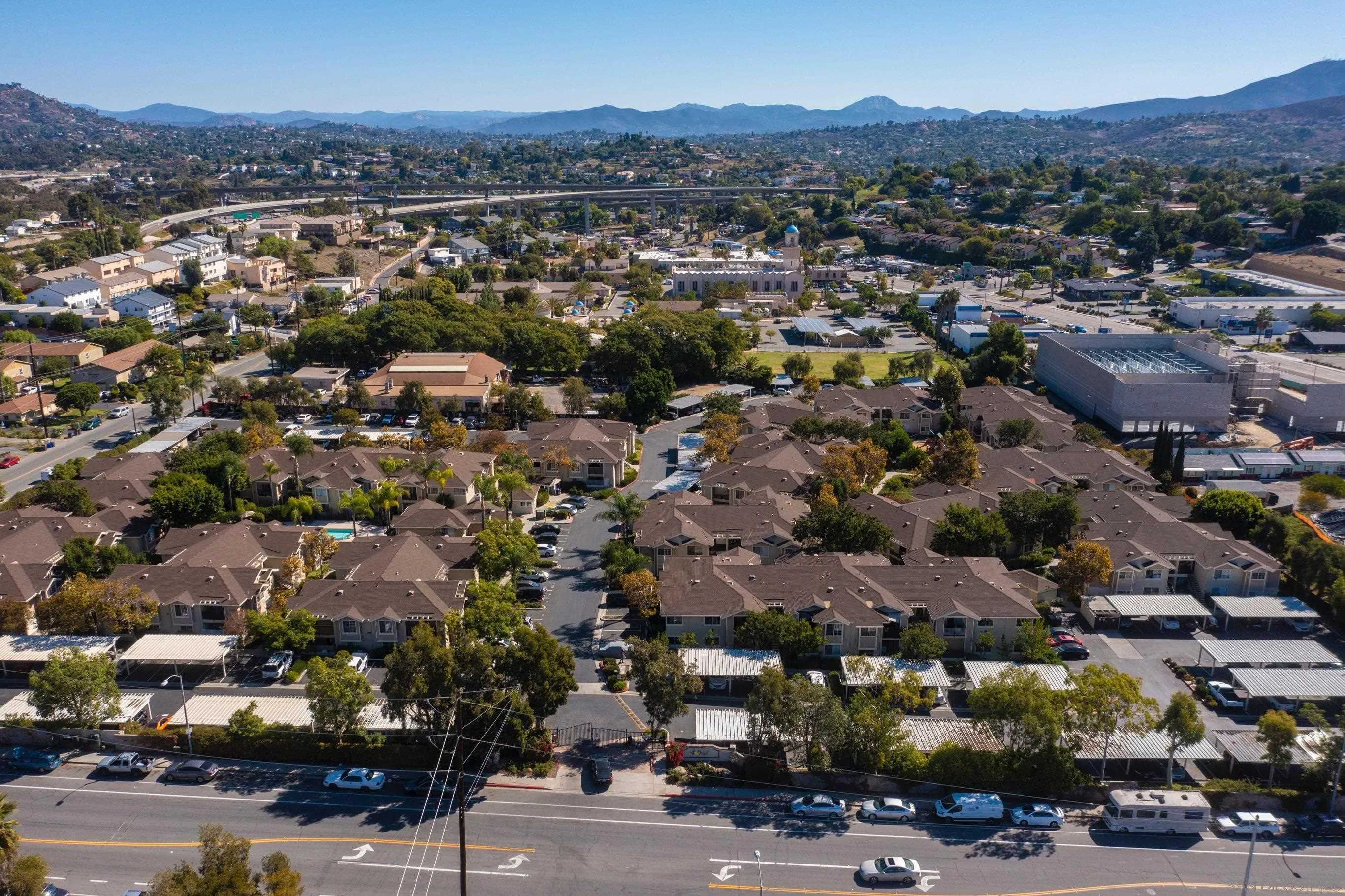 3545 Grove Street, Unit 227 Lemon Grove, CA 91945 - Photo 25 of 27 an aerial view of a city with lots of residential buildings